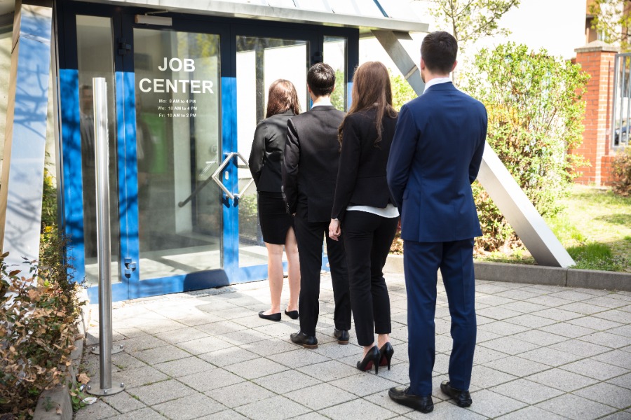 Young people standing in line at a Job Centre